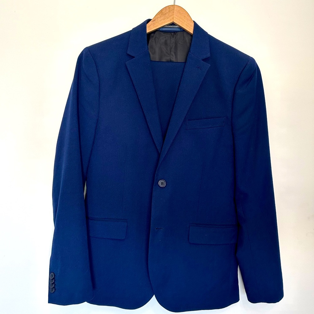H&M rich blue suit. Slim fit. Size 38 jacket; size 34R pants. Good condition.